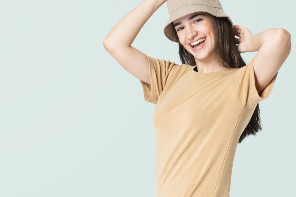 Woman in beige t-shirt dress and bucket hat casual wear apparel